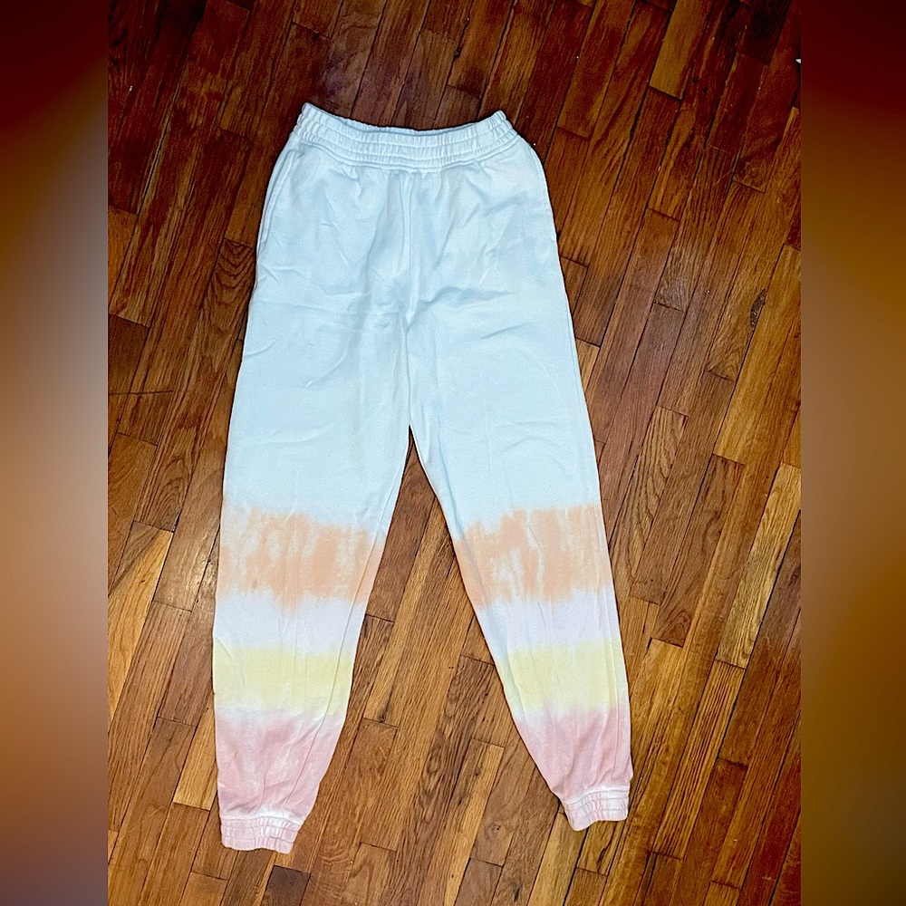 white sweatpants with pastel colors at bottom